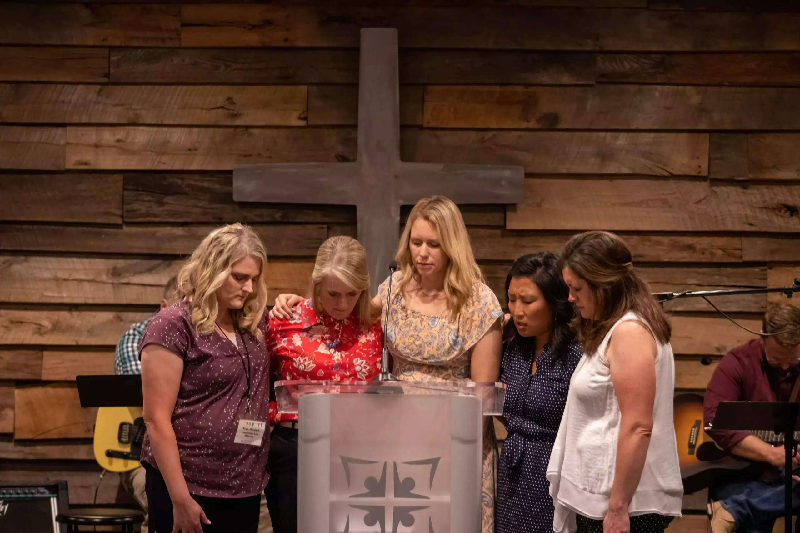Women praying together at Community Baptist Church